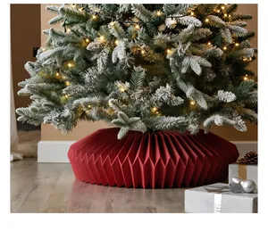 Detailed view of a red pleated Christmas tree collar in a festive setting