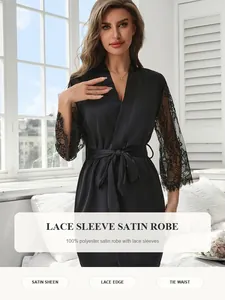 Close-up detail of black satin robe with elegant lace sleeves and tie waist design