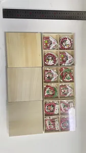 Detailed view of boxed wooden Christmas ornaments with a ruler for precise scale
