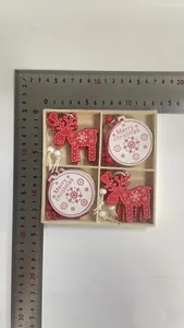 Detailed view of wooden Christmas ornaments set in box with measurement rulers