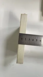 Macro view showing the side thickness of a wooden Christmas ornament with ruler