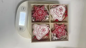 Detailed view of wooden Christmas ornaments on a digital scale showing product weight info