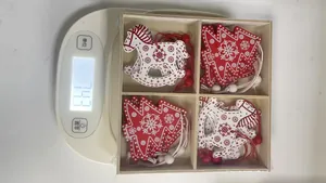 Boxed set of wooden Christmas ornaments including trees and horses weighing 74.3g