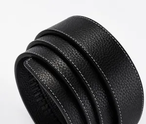 Close-up detail of black leather belt strap with white stitching and textured finish