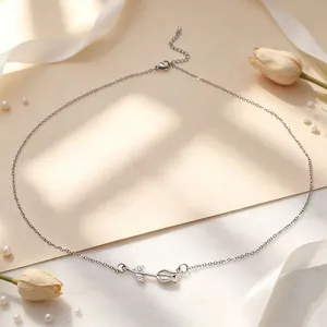 Silver tulip necklace with chalcedony stone detail in a minimalist aesthetic setting