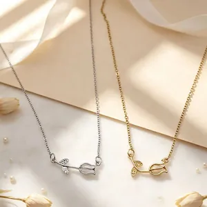 Close-up of elegant tulip necklaces in gold and silver finishes with cat's eye stone