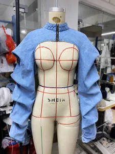 Detailed front view of a light blue denim ultra-short bolero jacket on a mannequin