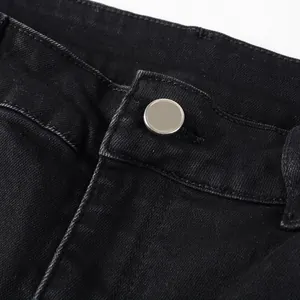 Macro detail showing the silver button and black denim texture of these men's slim fit jeans