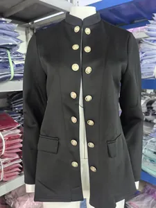 Detailed front view of a black women's jacket with double-breasted gold crest buttons