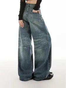 Professional back view of retro wide-leg denim jeans with vintage wash and whiskers
