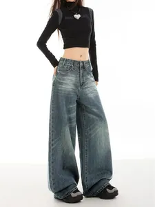 Full-length view of high-waist vintage wide-leg denim jeans with retro wash detail