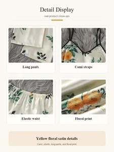 Close-up details of yellow floral satin pajamas showing cami straps and elastic waist
