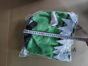Detailed measurement view of green plush monster hat for St. Patrick's Day festival