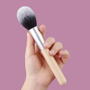 Large soft powder blush brush with wooden handle and flame-shaped fiber bristles