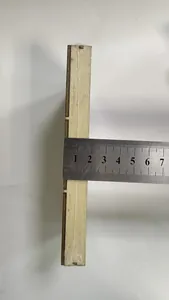 Close-up showing the 1.5cm thickness measurement of the wooden Christmas ornament