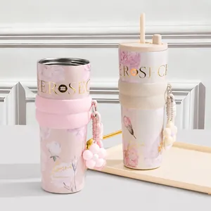 Detailed view of floral insulated coffee tumblers with straw and direct drinking lids