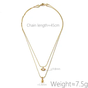 Detailed view of a gold double-layer necklace with angel eye and teardrop pendants.