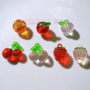 Transparent acrylic fruit pendants for DIY crafts including strawberry and apple shapes