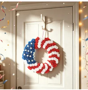 Detail of Independence Day wreath with red white and blue PU roses hanging on a white door