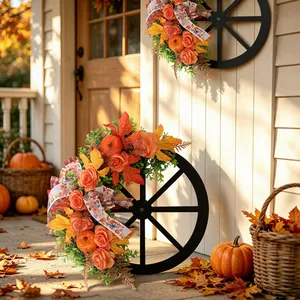 Autumn Thanksgiving wreath on wooden wagon wheel with roses and pumpkins for garden
