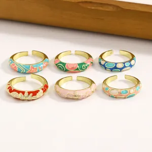 Detailed view of six colorful enamel dripping oil alloy rings with vintage patterns