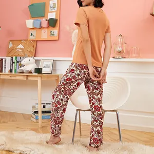 Women's cozy orange short sleeve pajama set with floral print long pants for summer