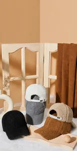 Close-up of warm lamb wool baseball caps in various colors with adjustable metal buckles