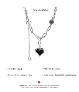 Punk style silver chain necklace with pixelated black heart pendant and sparkly rhinestones