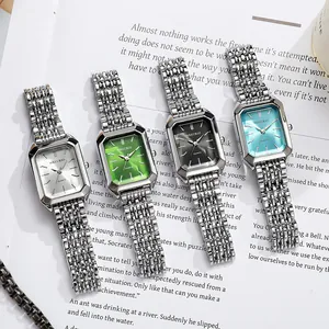 Detailed shot of four square women's watches with colorful dials and steel bands