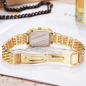 Back view of elegant gold square women's watch with metal link strap