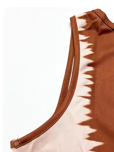Close-up detail of brown and cream tie-dye pattern on sleeveless bodysuit fabric