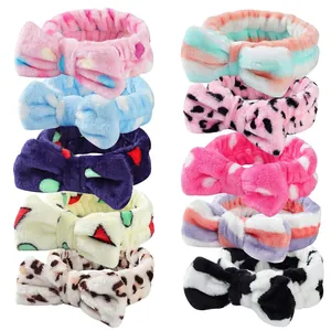 Set of 10 soft coral fleece spa headbands with cute bow ties for washing face.