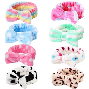 Detailed view of eight colorful coral fleece bow headbands for SPA and face washing