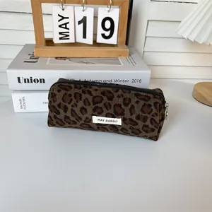Leopard print corduroy pencil case with secure zipper closure and MAY RABBIT brand tag label