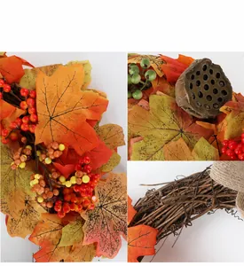 Close-up details of artificial maple leaves, red berries, and natural vine base