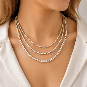 Elegant triple-layered gold tennis necklace with sparkling cubic zirconia stones