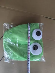 Green plush velvet squid hat detail showing measurement scale for size accuracy