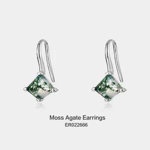 Detailed view of geometric square green moss agate earrings with silver hooks and natural patterns