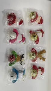 Variety of Christmas plush doll ornaments featuring colorful bells for tree decoration