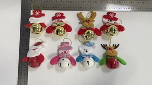 Detailed view of plush Christmas character ornaments with large metal bells