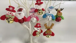 Detailed view of assorted Christmas ornaments with Santa and reindeer holding colorful bells.