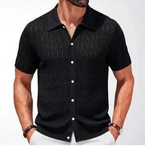 Detail view of men's black knit Polo shirt with intricate jacquard texture and buttons
