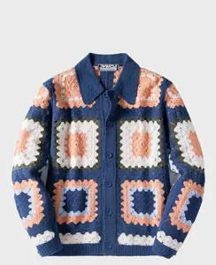 Detailed view of colorful crochet knitted cardigan with artistic geometric patterns