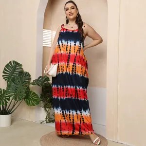 Vibrant tie-dye plus size maxi dress with spaghetti straps and loose floor-length fit.