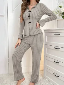Grey ribbed two-piece loungewear set featuring a bow-accented long-sleeve top