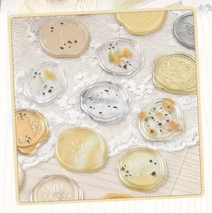 Various translucent wax seal stickers with delicate floral and botanical patterns