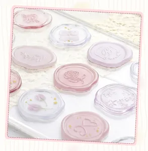 Detail view of translucent imitation wax seal stickers with floral and heart patterns
