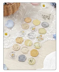 Detailed macro view of multiple vintage faux wax seal stickers with floral designs