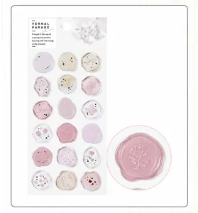 Close-up of semi-transparent floral wax seal stickers with embossed texture detail