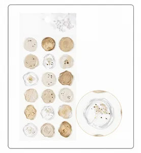 Macro detail of translucent wax seal sticker with delicate white floral pattern